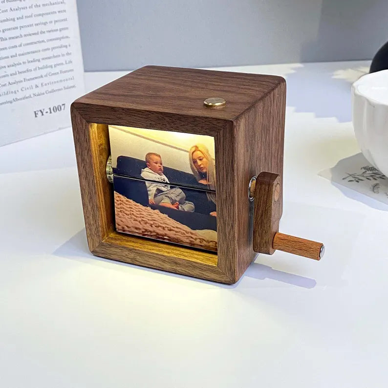 Custom photo flipbook frame, hand-cranked animation, black walnut baby cube—an inventive gift for treasured memories