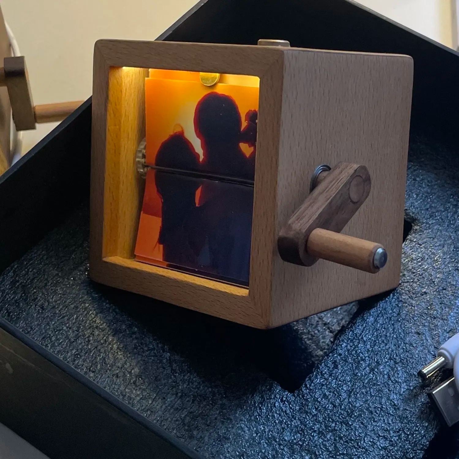 Custom photo flipbook frame, hand-cranked animation, black walnut baby cube—an inventive gift for treasured memories