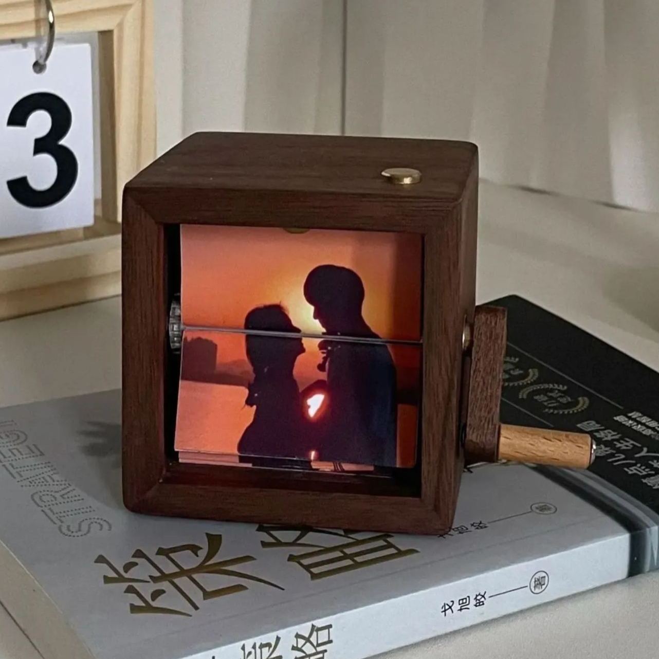 Custom photo flipbook frame, hand-cranked animation, black walnut baby cube—an inventive gift for treasured memories